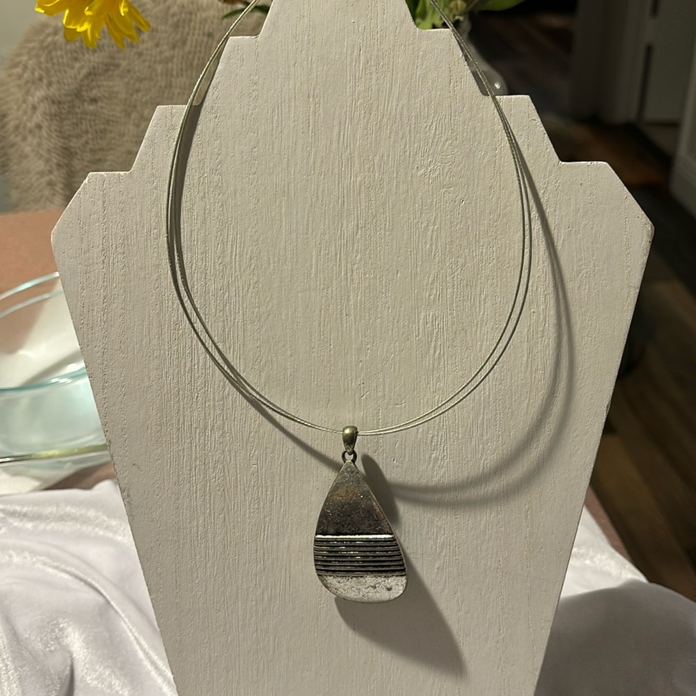 Vintage silvertone necklace with interesting pendant.